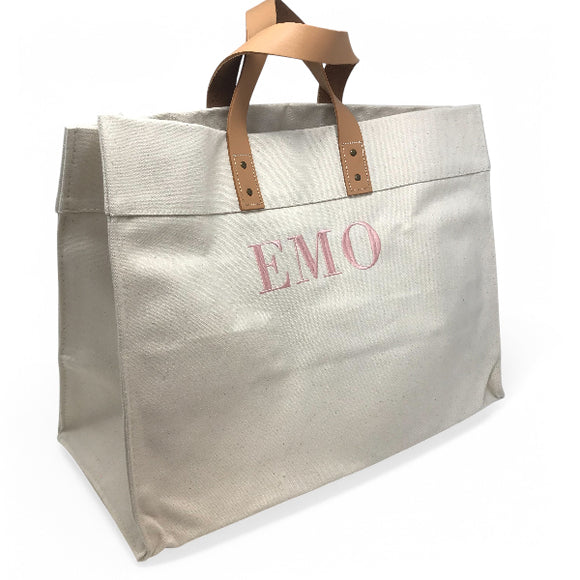 Heavyweight canvas tote bag with boxy shape and leather handles, monogrammed by Initially London